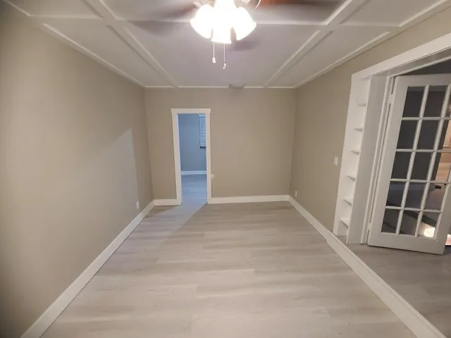 a view of an empty room with a window