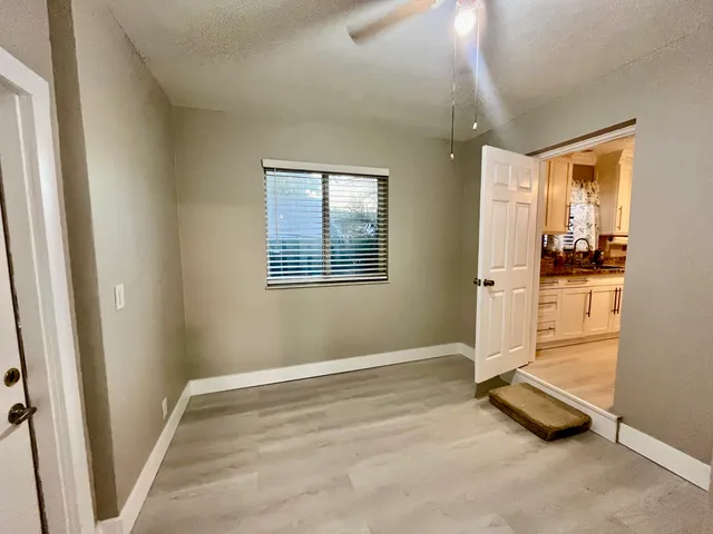 a view of a room with wooden floor and walls
