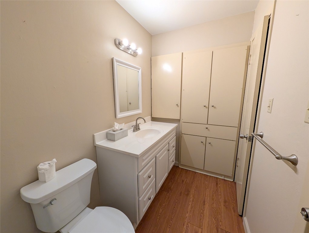 7801 Shoal Creek Boulevard, Unit 147 Austin, TX 78757 - Photo 11 of 15 a bathroom with a sink and mirror with toilet