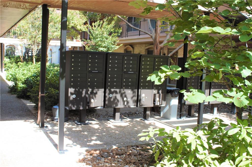 7801 Shoal Creek Boulevard, Unit 147 Austin, TX 78757 - Photo 14 of 15 a front view of a house with a yard