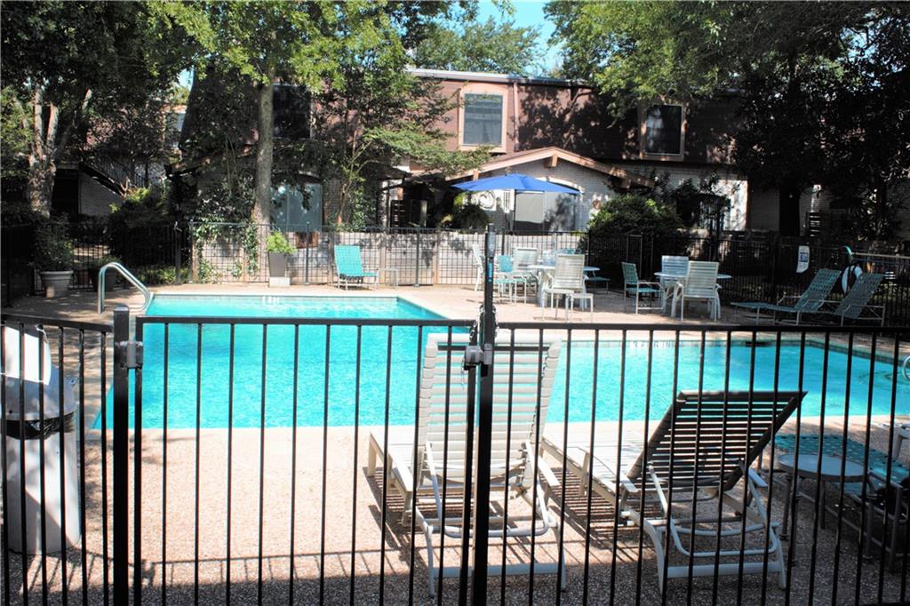 7801 Shoal Creek Boulevard, Unit 147 Austin, TX 78757 - Photo 15 of 15 a view of a house with backyard and trees