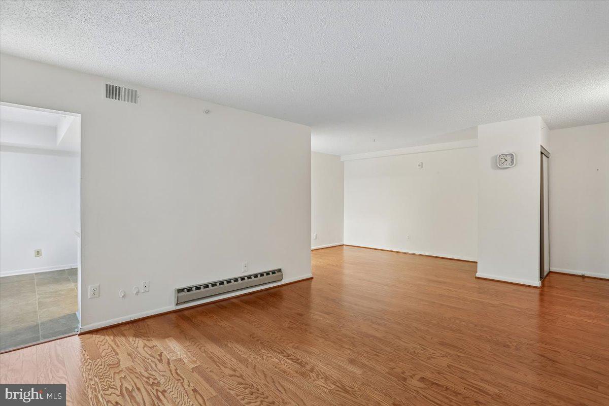 15210 Elkridge Way, Unit 912E Silver Spring, MD 20906 - Photo 11 of 48 a view of a room with wooden floor