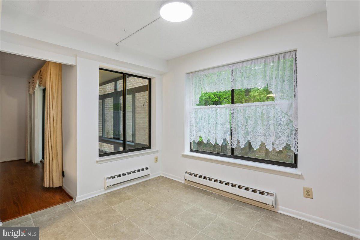 15210 Elkridge Way, Unit 912E Silver Spring, MD 20906 - Photo 16 of 48 a view of an empty room with a window
