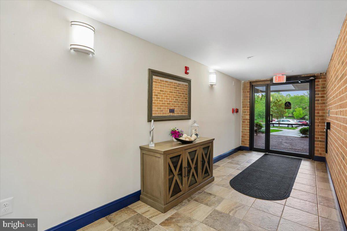 15210 Elkridge Way, Unit 912E Silver Spring, MD 20906 - Photo 3 of 48 a living room with furniture