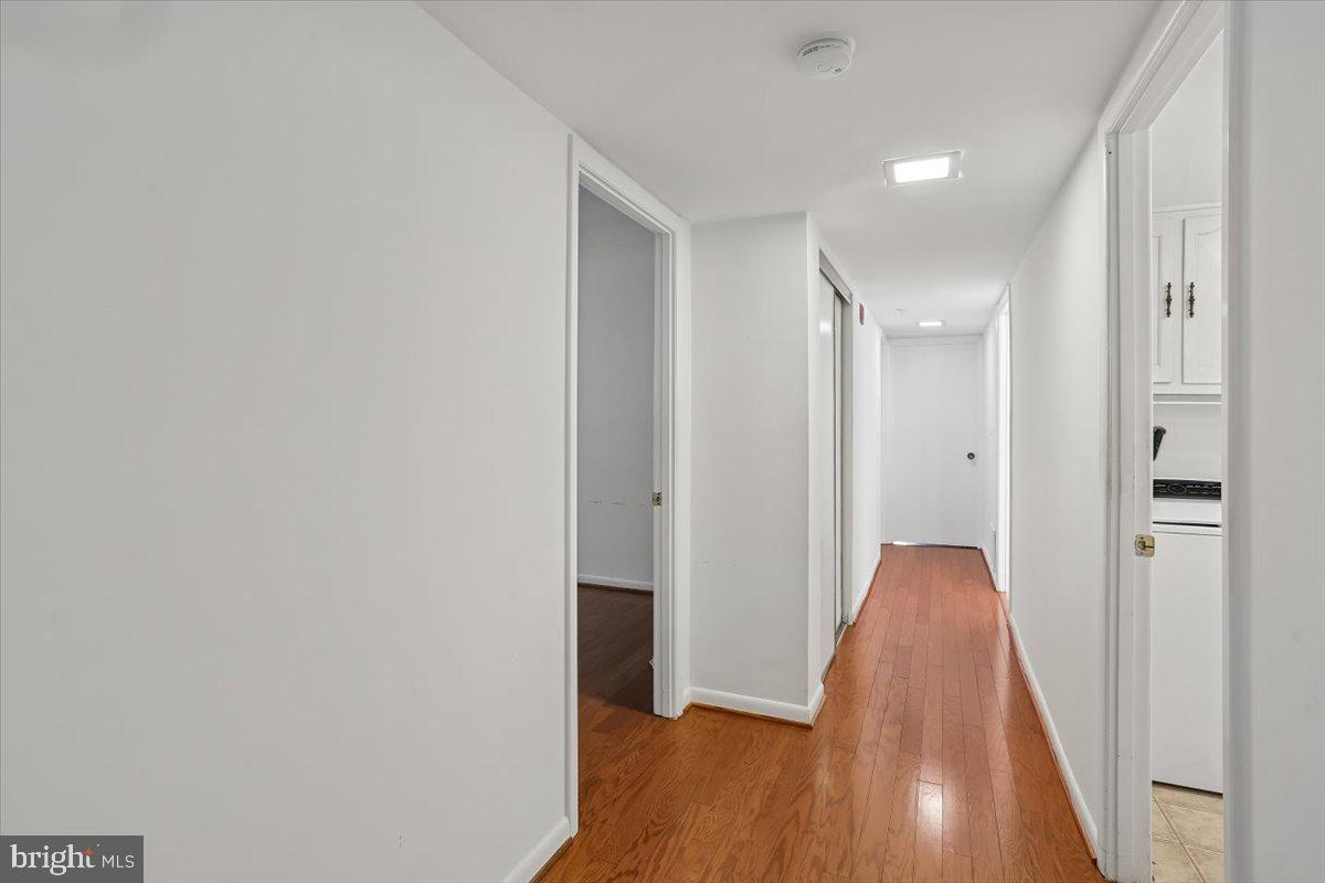 15210 Elkridge Way, Unit 912E Silver Spring, MD 20906 - Photo 37 of 48 a view of hallway with wooden floor