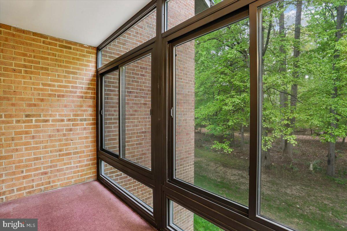 15210 Elkridge Way, Unit 912E Silver Spring, MD 20906 - Photo 8 of 48 a view of a floor to ceiling window and wooden floor