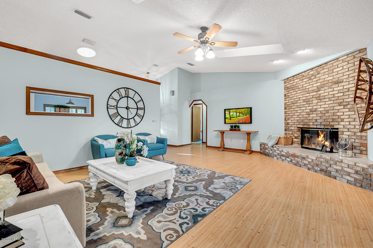215 Cornell Road St. Augustine, FL 32086 - Photo 5 of 28 a living room with furniture and a fireplace