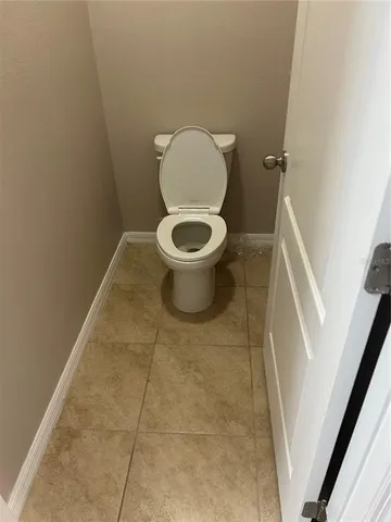 a bathroom with a toilet a sink and bathtub
