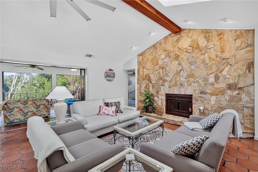 5307 Ladyfinger Lake Road Sanibel, FL 33957 - Photo 11 of 45 a living room with furniture and a fireplace