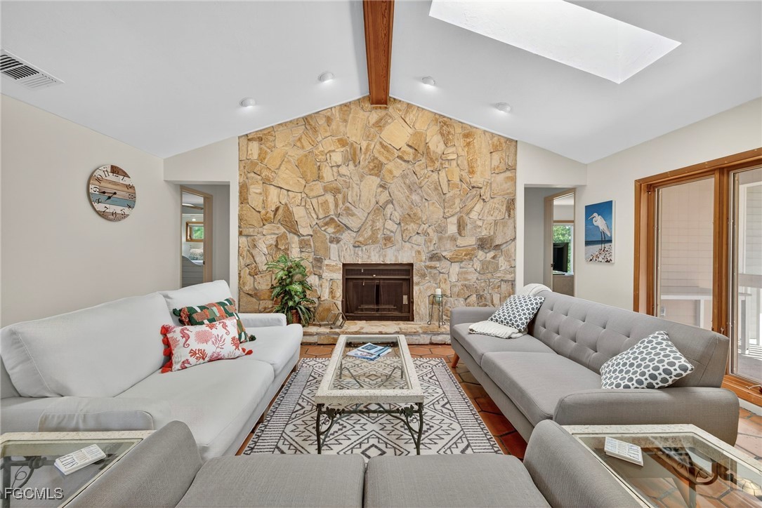 5307 Ladyfinger Lake Road Sanibel, FL 33957 - Photo 12 of 45 a living room with furniture and a fireplace