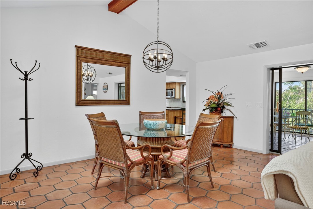 5307 Ladyfinger Lake Road Sanibel, FL 33957 - Photo 17 of 45 a dining room with furniture and window