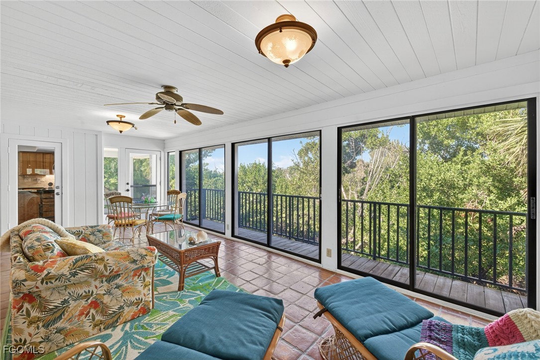 5307 Ladyfinger Lake Road Sanibel, FL 33957 - Photo 18 of 45 a living room with furniture and a large window