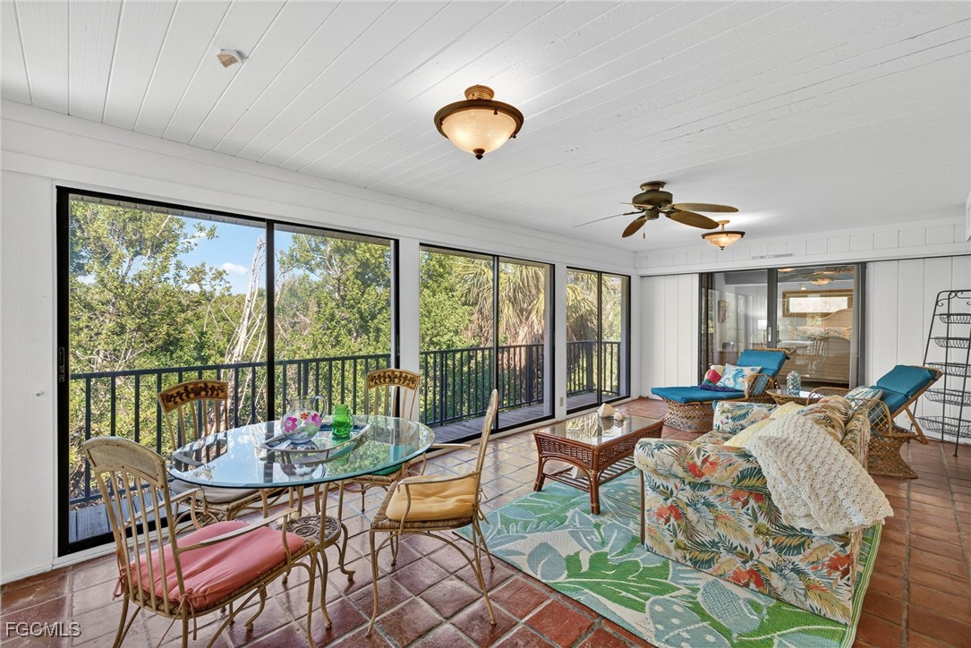 5307 Ladyfinger Lake Road Sanibel, FL 33957 - Photo 19 of 45 a living room with furniture and a large window