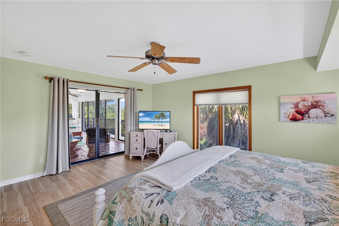 5307 Ladyfinger Lake Road Sanibel, FL 33957 - Photo 21 of 45 a bed room with a bed and a chandelier