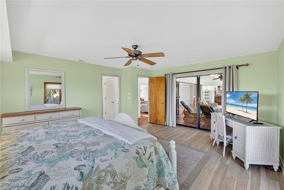5307 Ladyfinger Lake Road Sanibel, FL 33957 - Photo 22 of 45 a bedroom with a bed and a flat screen tv