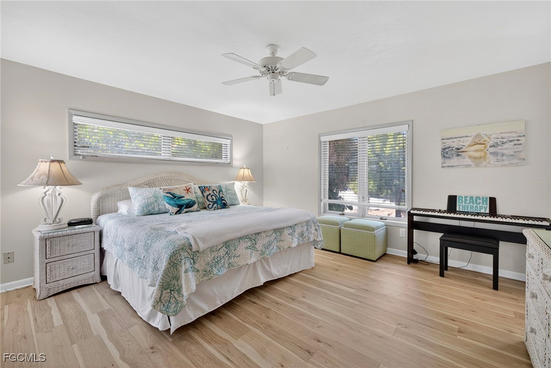 5307 Ladyfinger Lake Road Sanibel, FL 33957 - Photo 26 of 45 a bedroom with a bed and a table