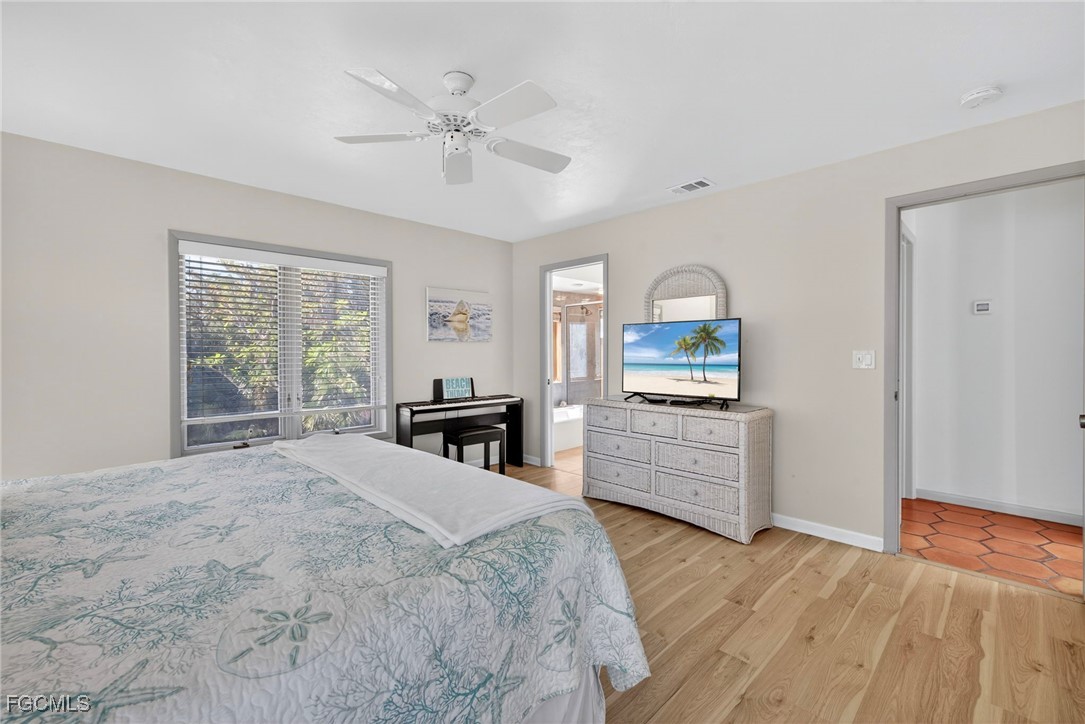 5307 Ladyfinger Lake Road Sanibel, FL 33957 - Photo 27 of 45 a bedroom with a bed and a dresser