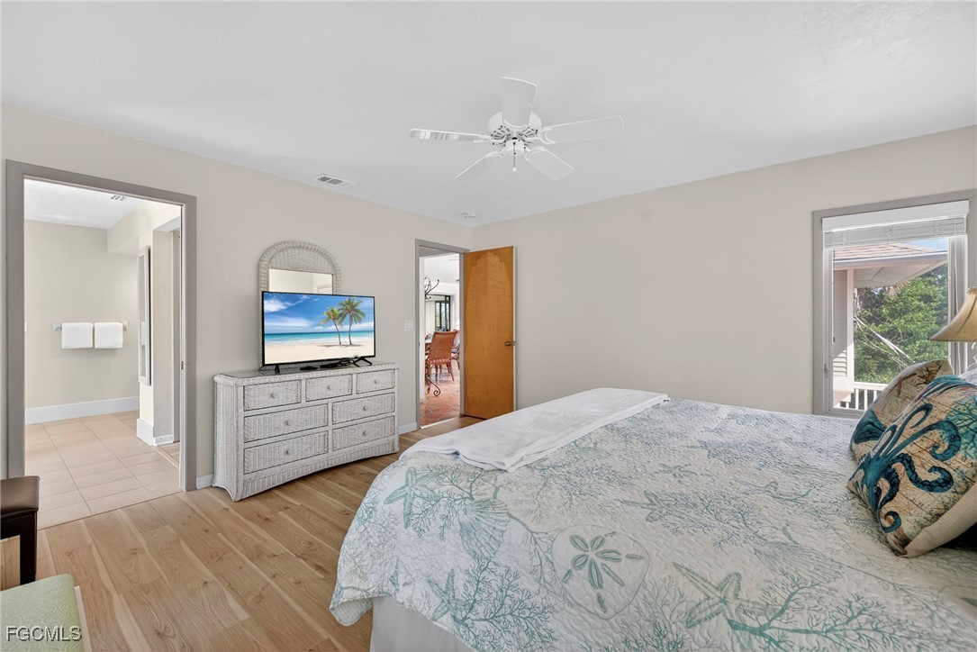 5307 Ladyfinger Lake Road Sanibel, FL 33957 - Photo 28 of 45 a bedroom with a bed and a dresser