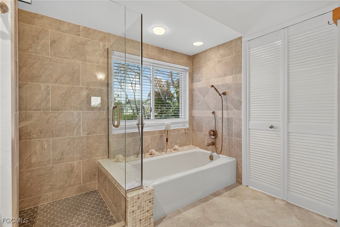 5307 Ladyfinger Lake Road Sanibel, FL 33957 - Photo 29 of 45 a spacious bathroom with a bathtub and shower