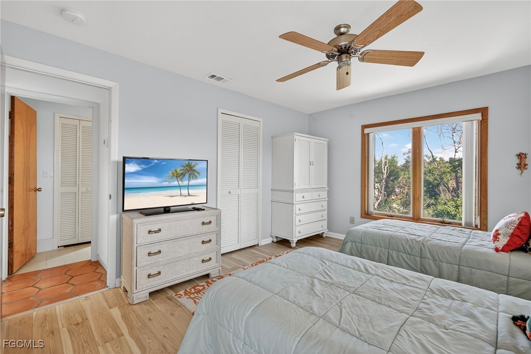 5307 Ladyfinger Lake Road Sanibel, FL 33957 - Photo 31 of 45 a bedroom with a bed and a television