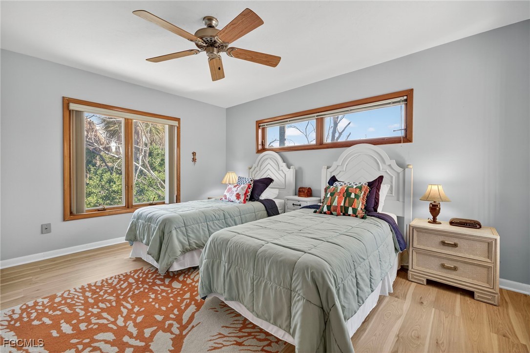 5307 Ladyfinger Lake Road Sanibel, FL 33957 - Photo 32 of 45 a bedroom with two beds and a window