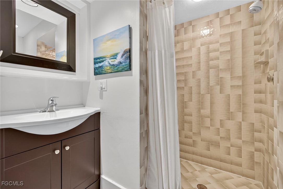 5307 Ladyfinger Lake Road Sanibel, FL 33957 - Photo 33 of 45 a bathroom with a sink and a mirror