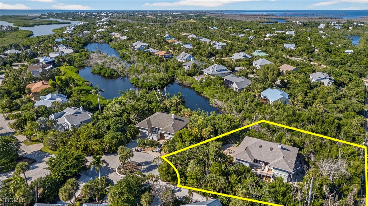 5307 Ladyfinger Lake Road Sanibel, FL 33957 - Photo 36 of 45 an aerial view of residential houses with outdoor space