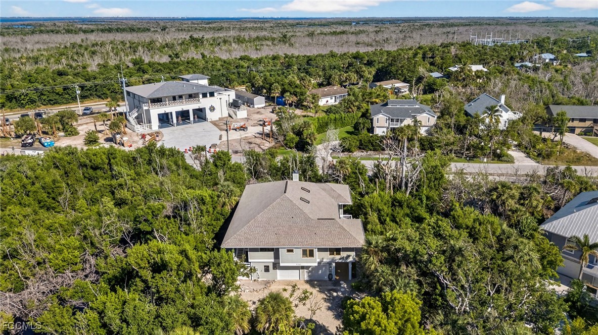 5307 Ladyfinger Lake Road Sanibel, FL 33957 - Photo 43 of 45 an aerial view of a house with yard and outdoor seating