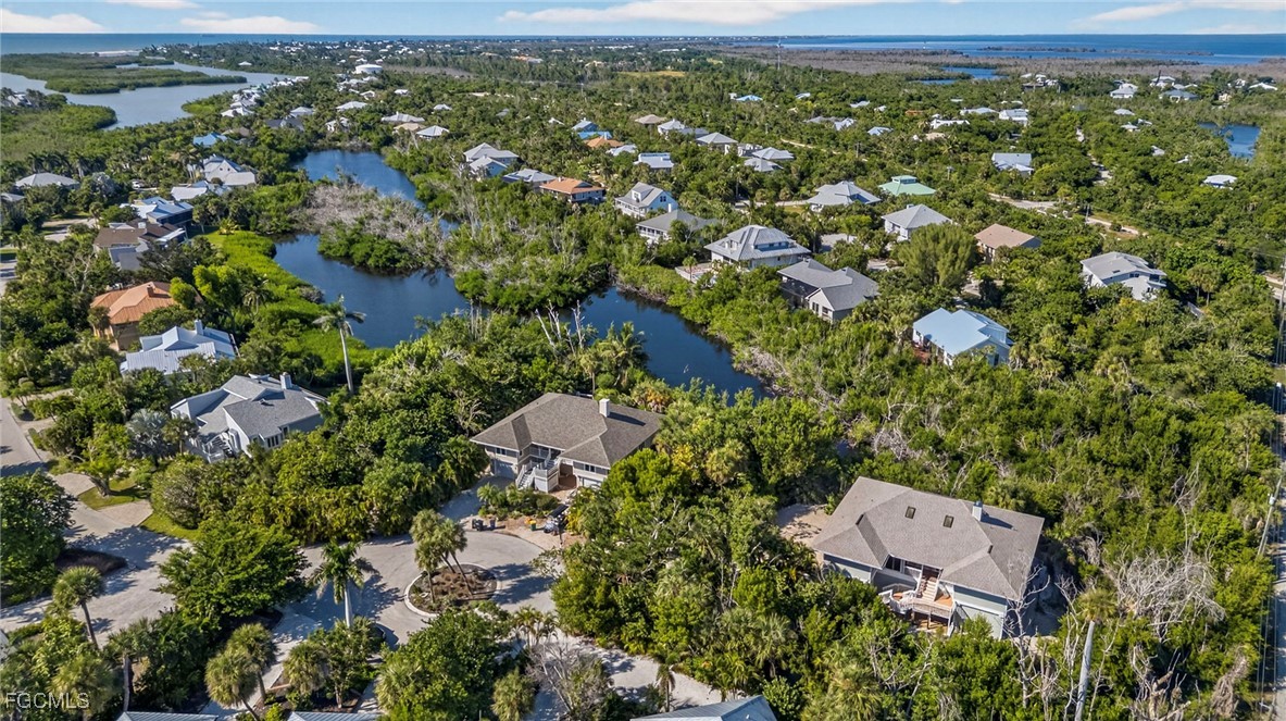 5307 Ladyfinger Lake Road Sanibel, FL 33957 - Photo 44 of 45 an aerial view of residential houses with outdoor space and trees
