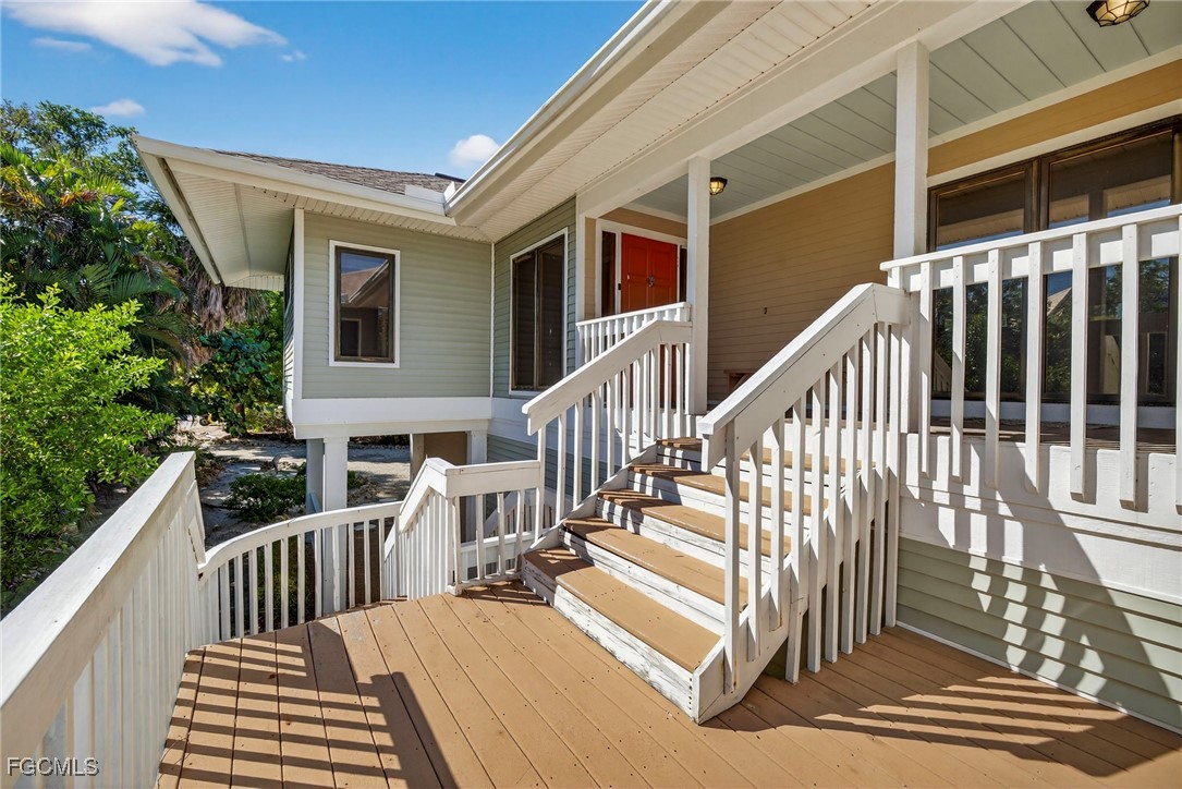 5307 Ladyfinger Lake Road Sanibel, FL 33957 - Photo 7 of 45 a view of a house with wooden deck