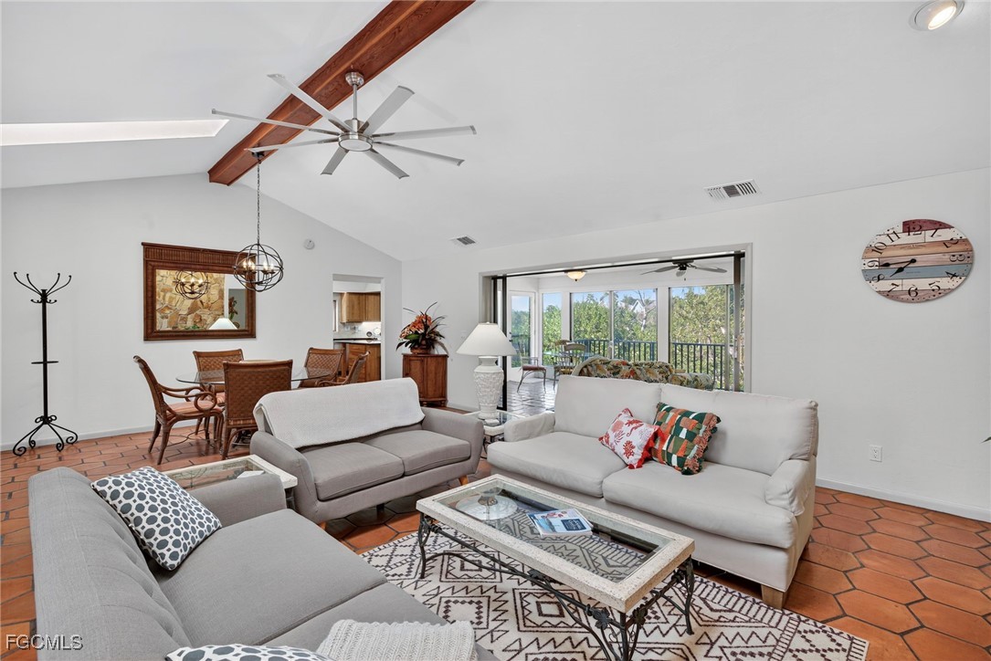 5307 Ladyfinger Lake Road Sanibel, FL 33957 - Photo 10 of 45 a living room with furniture and a large window