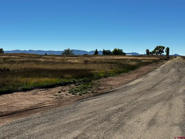 a view of a street with an ocean view