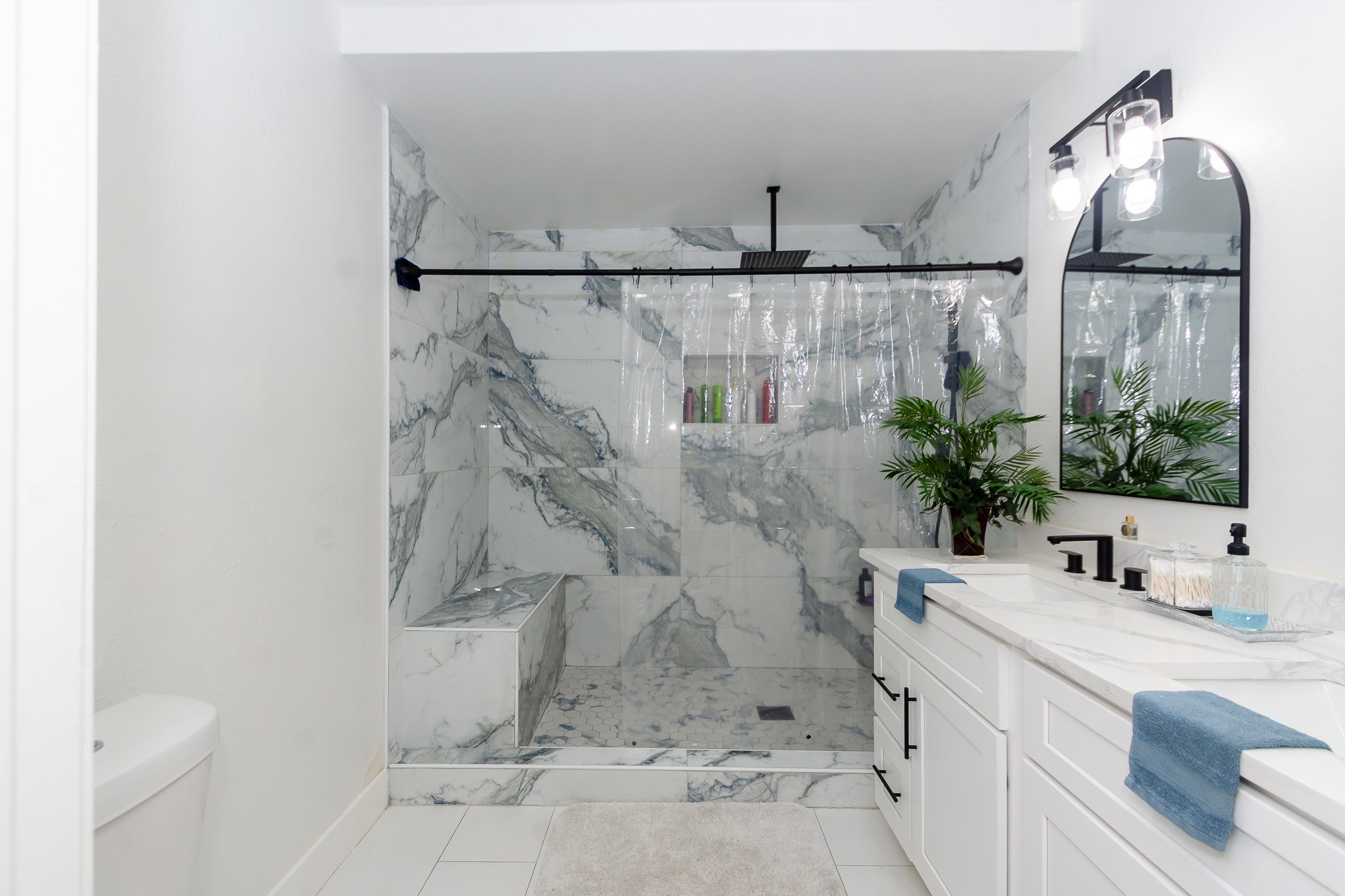 2930 West Shane Street Alvin, TX 77511 - Photo 12 of 19 a bathroom with a granite countertop sink mirror vanity and toilet