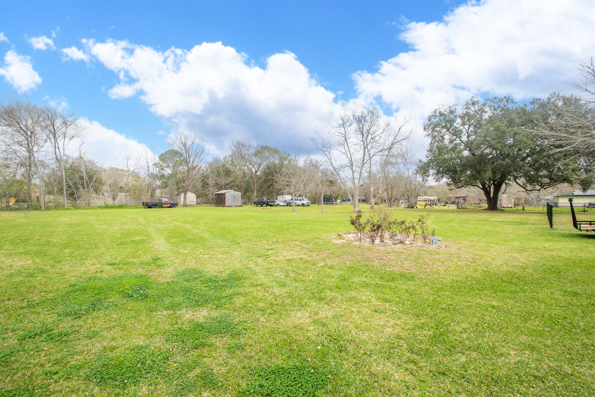 2930 West Shane Street Alvin, TX 77511 - Photo 17 of 19 a view of a golf course with a big yard