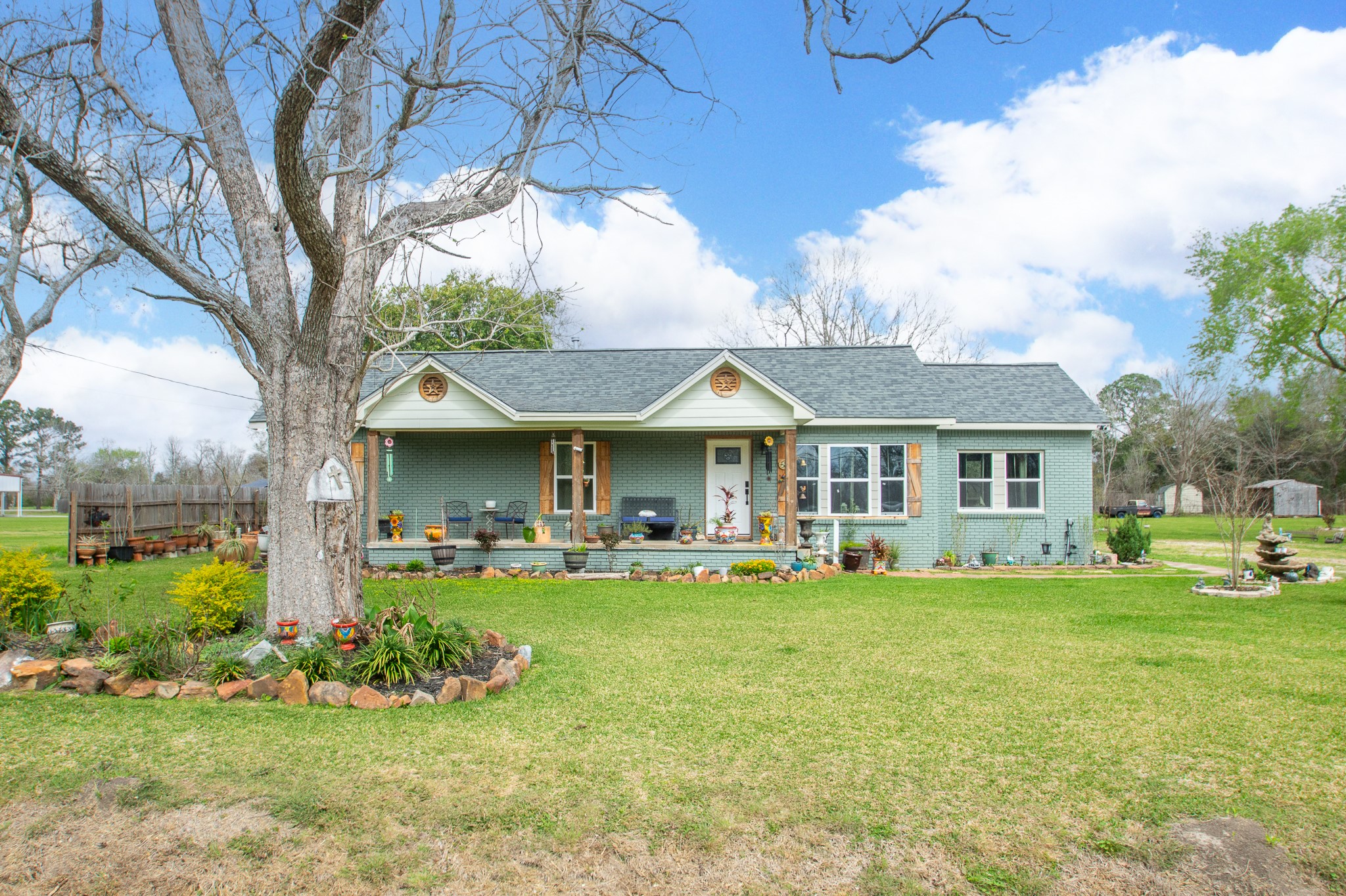 2930 West Shane Street Alvin, TX 77511 - Photo 3 of 19 a view of a house with a yard and sitting area