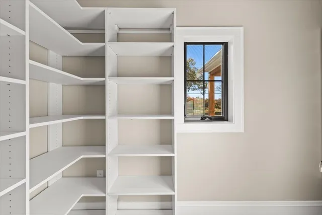 a view of an empty walk in closet