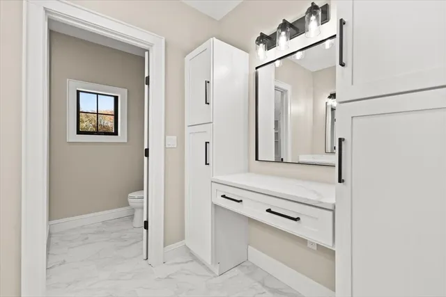 a bathroom with a double vanity sink and mirror