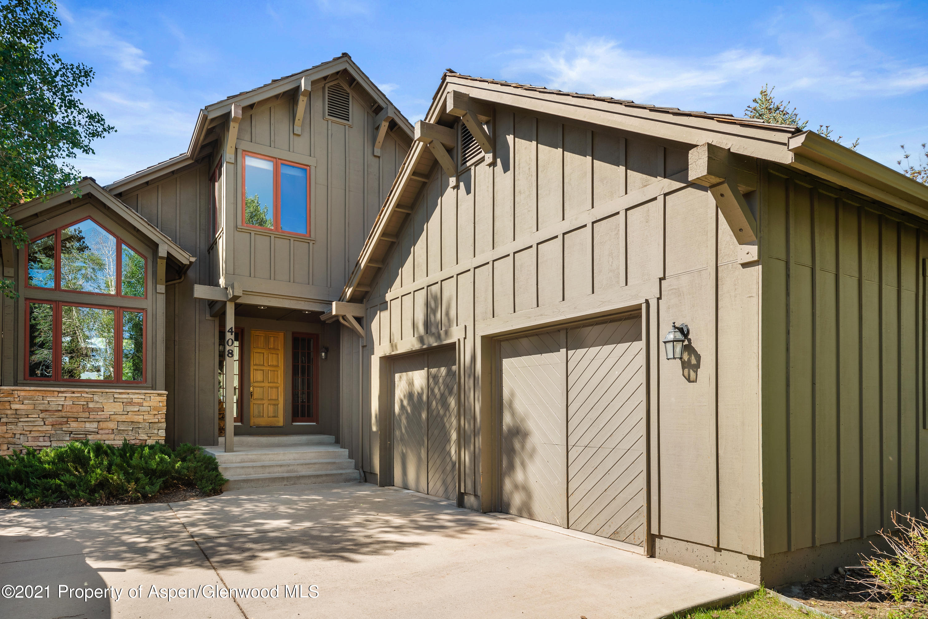 a front view of a house with wooden stairs