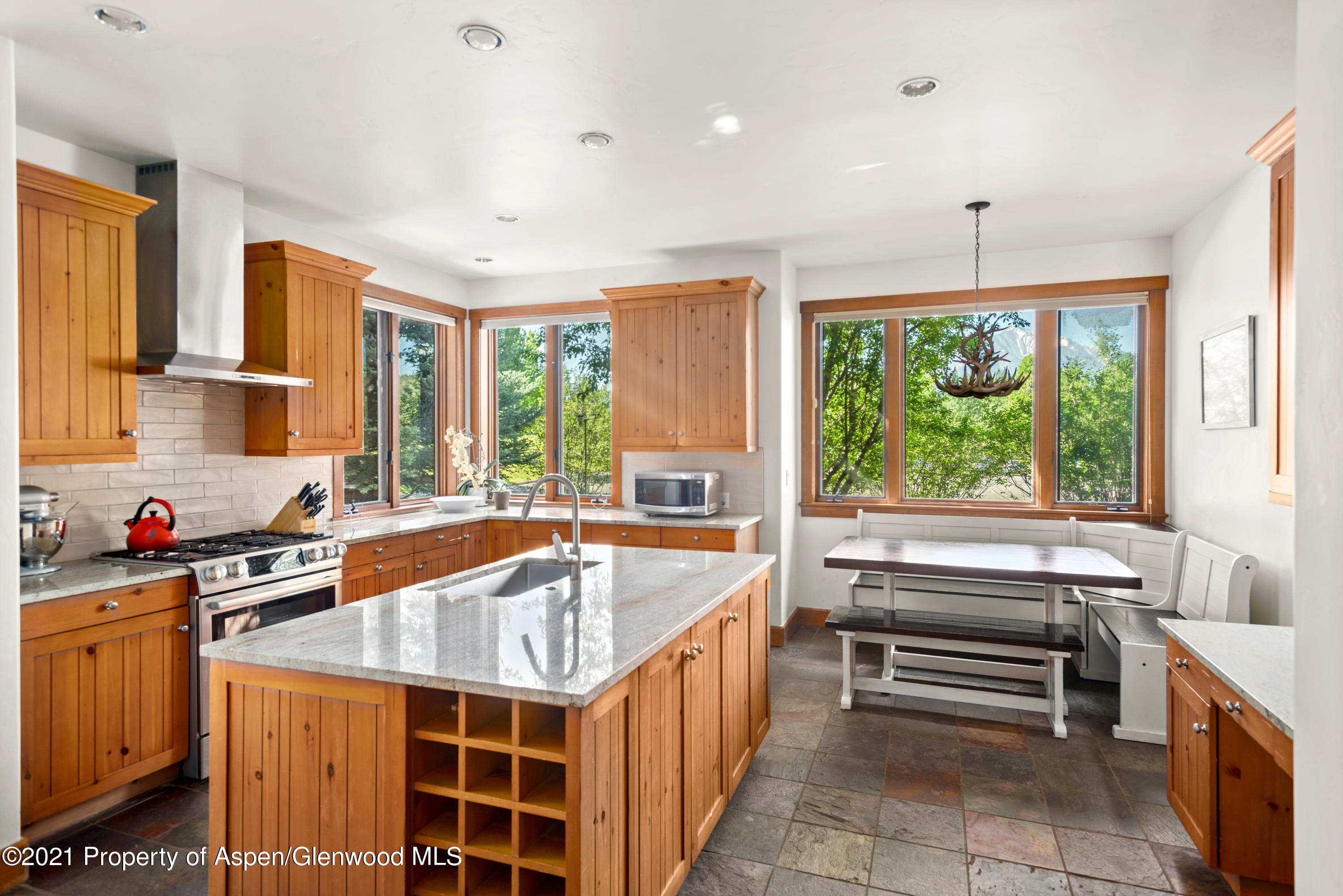 408 Settlement Lane Carbondale, CO 81623 - Photo 3 of 11 a kitchen with a stove a sink and a refrigerator
