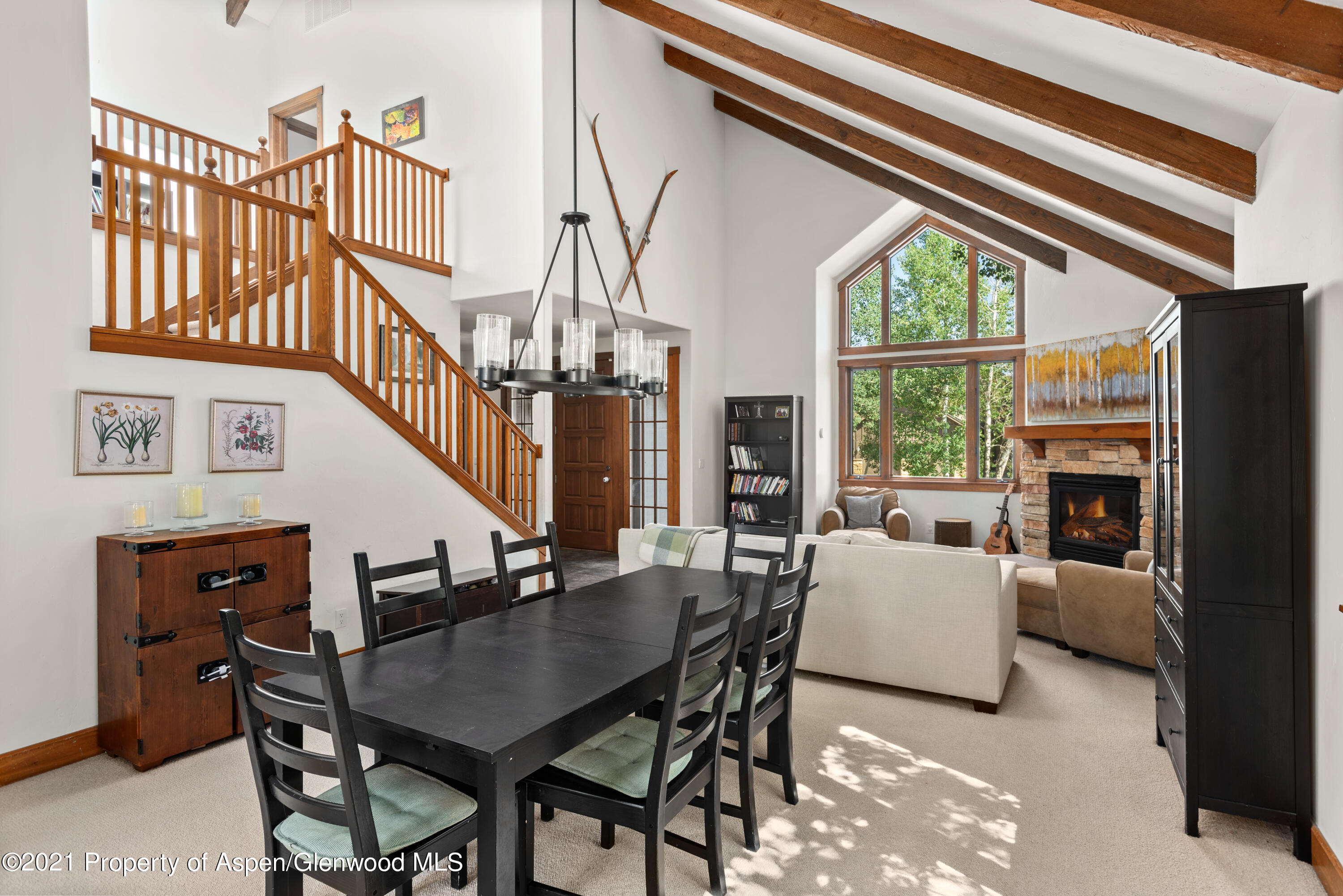 408 Settlement Lane Carbondale, CO 81623 - Photo 6 of 11 a living room with furniture a fireplace and a large window