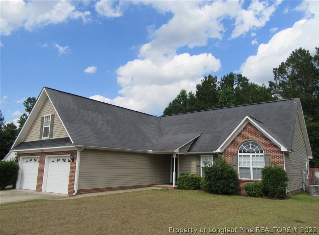 5503 Rising Ridge Drive Hope Mills, NC 28348 - Photo 6 of 6 a front view of a house with garden
