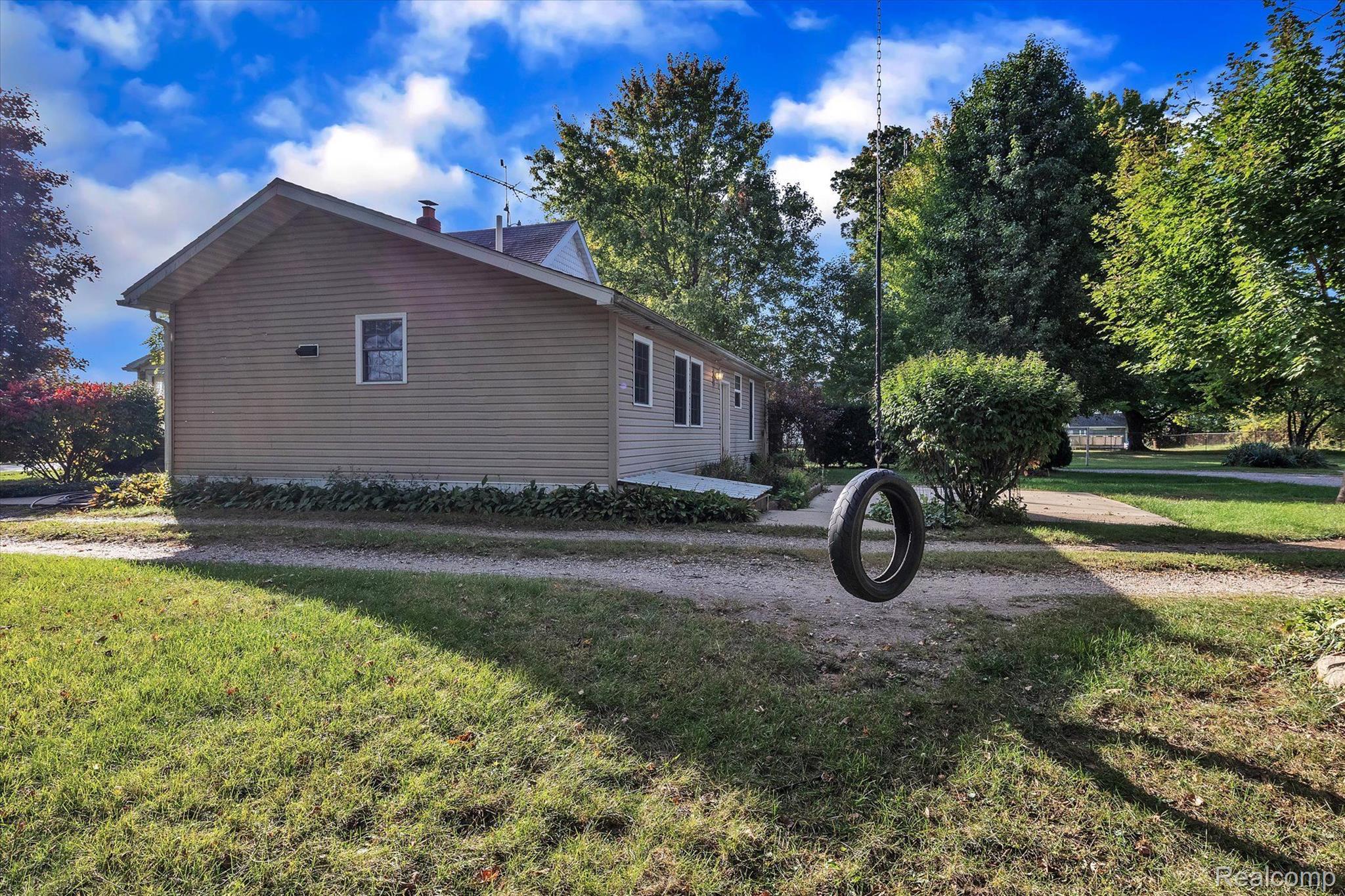 3310 Meridian Road Leslie, MI 49251 - Photo 31 of 49 Just the right size tire swing!