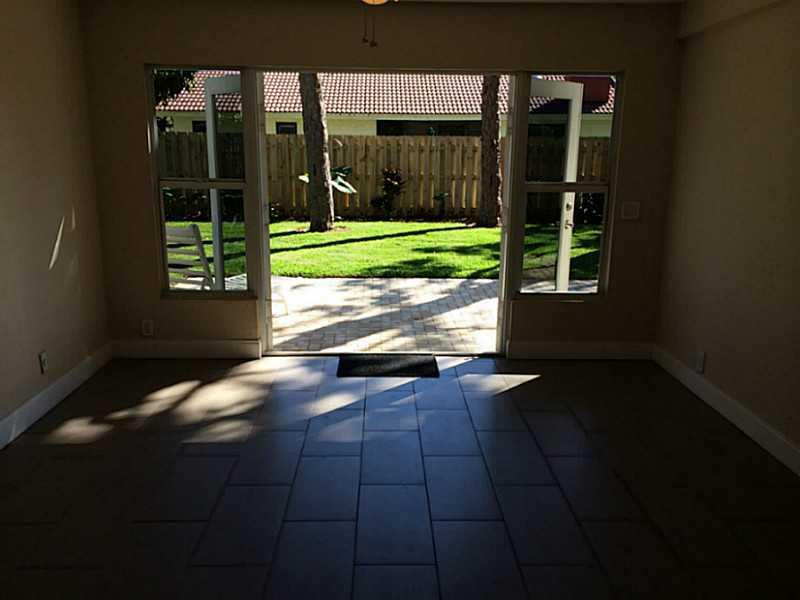 984 Southwest 4th Street Boca Raton, FL 33486 - Photo 14 of 22 a view of a house with a yard