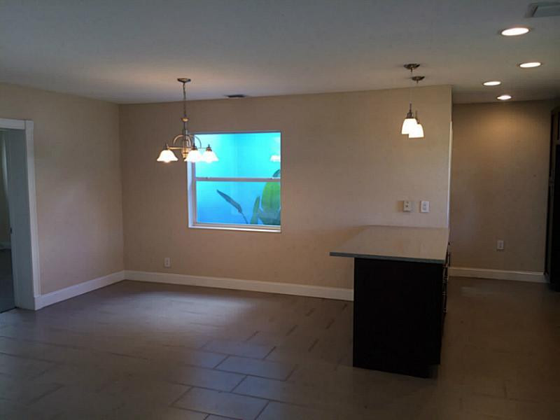 984 Southwest 4th Street Boca Raton, FL 33486 - Photo 15 of 22 an empty room with closet and a chandelier fan