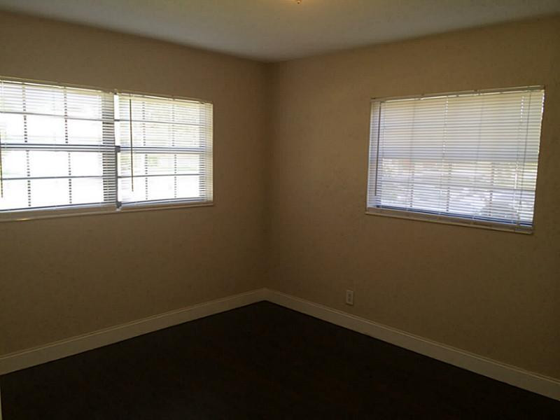 984 Southwest 4th Street Boca Raton, FL 33486 - Photo 20 of 22 an empty room with a window