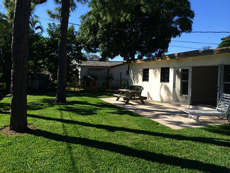 984 Southwest 4th Street Boca Raton, FL 33486 - Photo 4 of 22 a view of a backyard with plants and patio