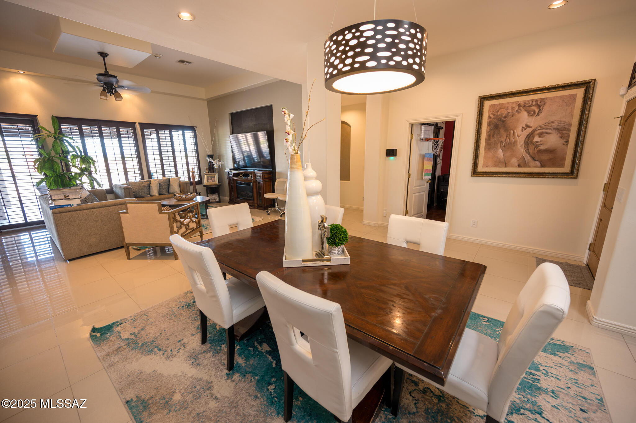 331 Via Bella Donna Rio Rico, AZ 85648 - Photo 13 of 46 a view of a dining room with furniture window and wooden floor