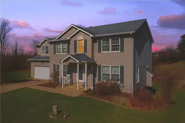 a front view of a house with a yard