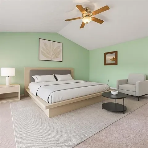 a bedroom with a bed and a couch