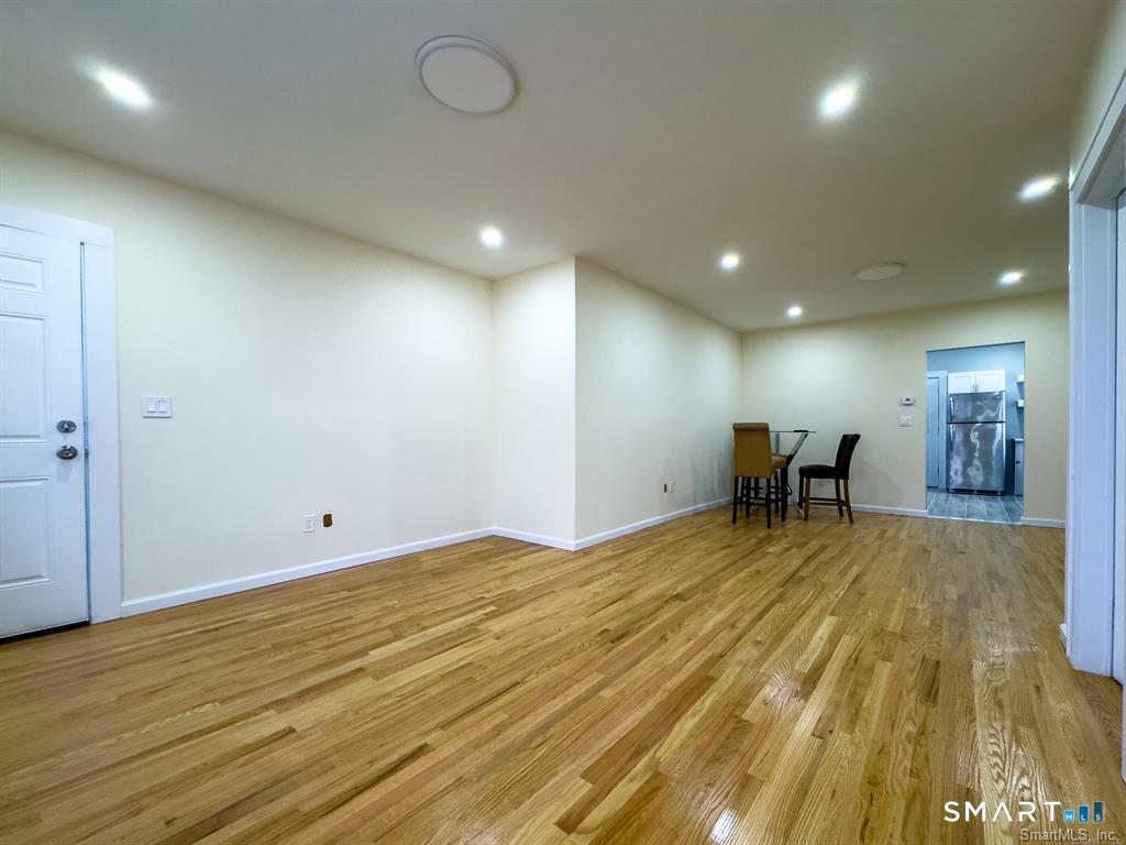 23 Lake Street Waterbury, CT 06708 - Photo 11 of 17 a view of an empty room with wooden floor